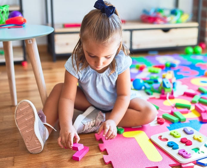 kid playing with educational toys