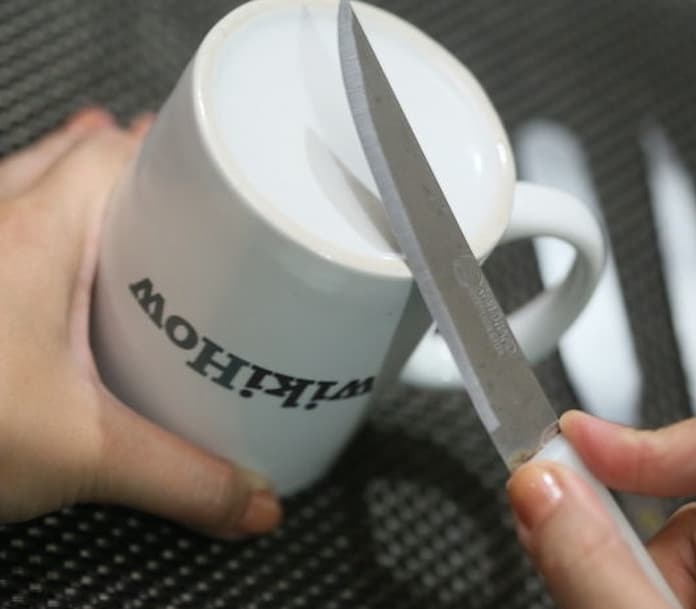 Ceramic cup using as a Knife Sharpener