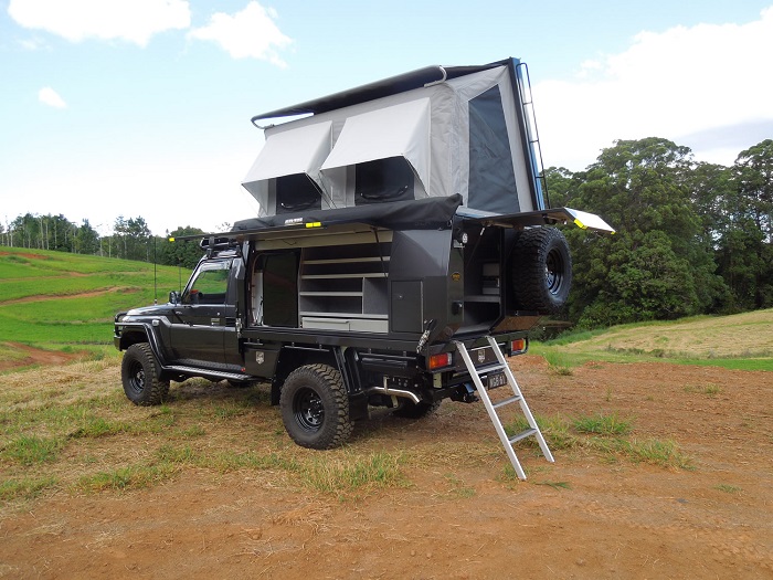 picture of a ute tray lift off canopy on a field 