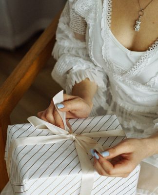 woman unwrapping a gift