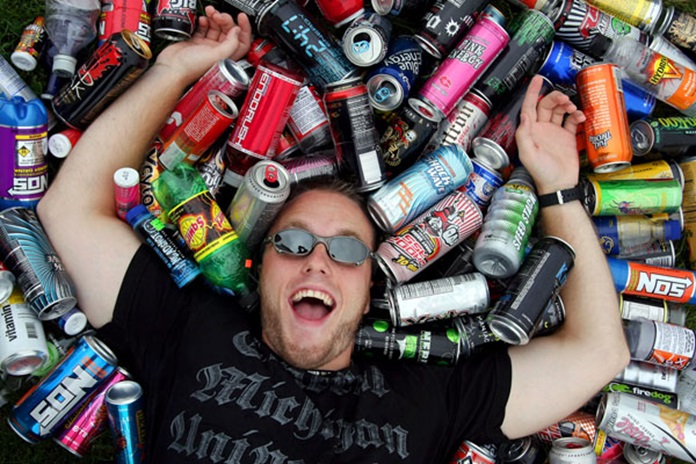Grand Blanc graduate student Dusty Smith poses for a portrait surrounded by a small portion of his energy drink bottle collection.  He started drinking energy drinks during the 2006-07 school year to keep up with his busy lifestyle.  Since then, he has downed 376 different kinds of energy drinks.  "I'll be over 400 by Christmas," Smith said.