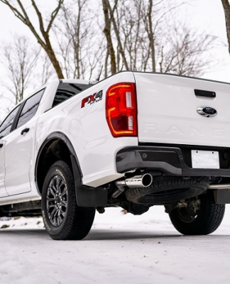 White Ford Ranger with aftermarket exhaust on snow