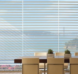 a dinner table in a room with big window