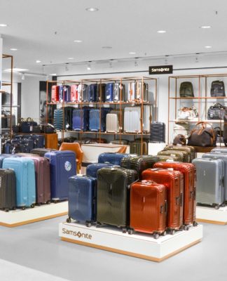 Interior of a Samsonite store showcasing a variety of suitcases and travel bags.