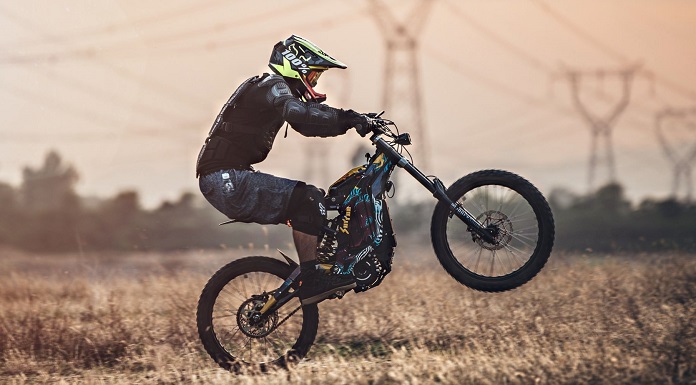 man jumping with an e-motorcycle